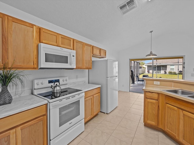 kitchen with white appliances, a textured ceiling, decorative light fixtures, light tile patterned flooring, and sink