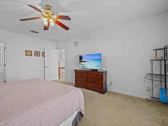 bedroom featuring ceiling fan and light colored carpet