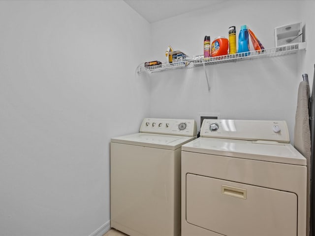 laundry room featuring washing machine and clothes dryer