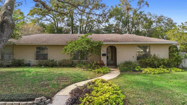 ranch-style house with a front lawn