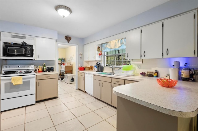 kitchen featuring kitchen peninsula, light tile patterned floors, white appliances, and sink