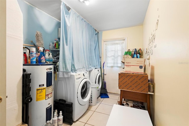 laundry room featuring light tile patterned floors and water heater