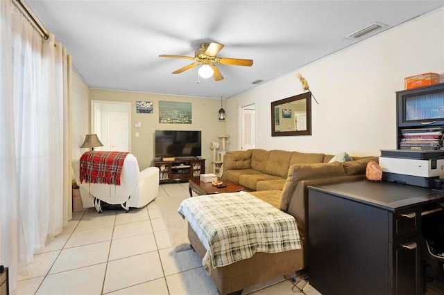 tiled living room with ceiling fan