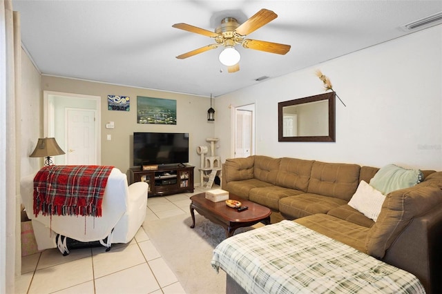 living room featuring ceiling fan and light tile patterned floors