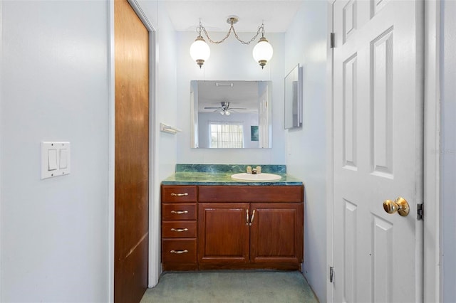 bathroom with ceiling fan and vanity