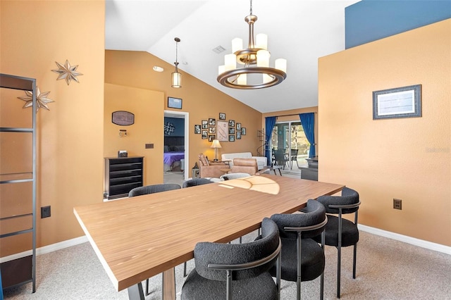 dining area with lofted ceiling, carpet floors, and an inviting chandelier