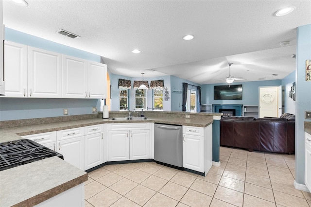 kitchen with ceiling fan, dishwasher, hanging light fixtures, kitchen peninsula, and white cabinets