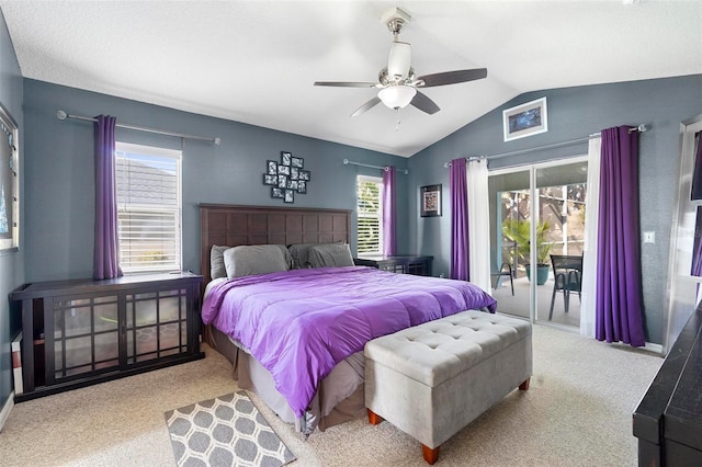 carpeted bedroom featuring ceiling fan, access to exterior, and vaulted ceiling