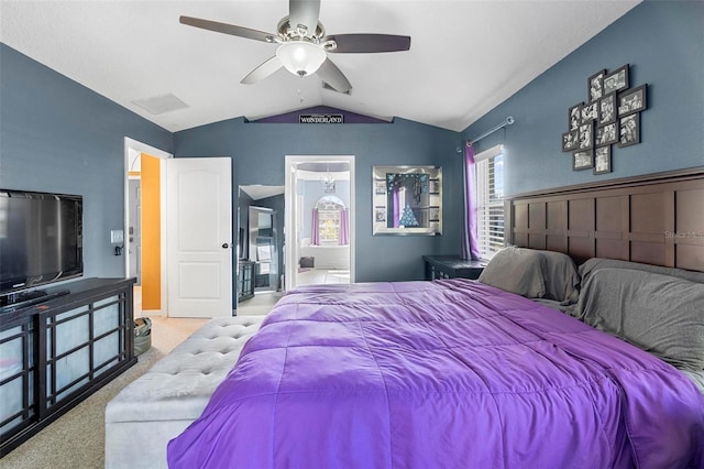 bedroom with light colored carpet, ceiling fan, and lofted ceiling