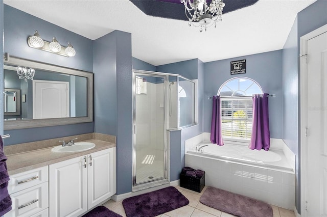 bathroom with tile patterned flooring, vanity, separate shower and tub, and a chandelier