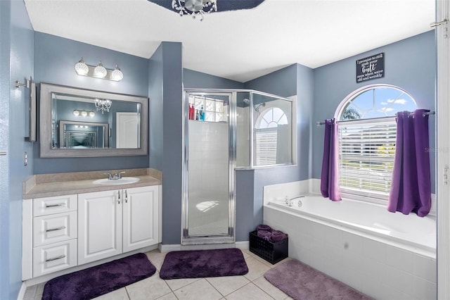 bathroom with tile patterned floors, vanity, and independent shower and bath