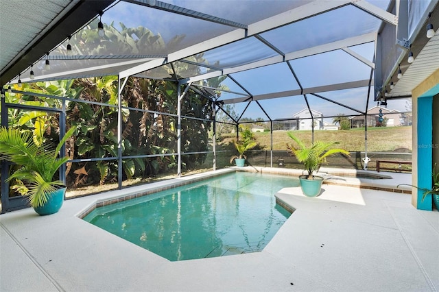 view of pool featuring a lanai and a patio area