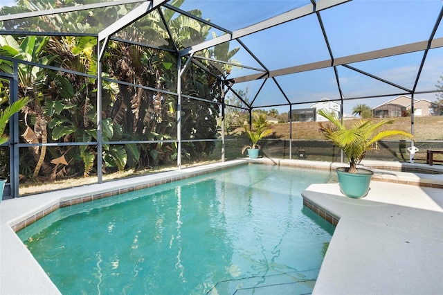 view of pool with a lanai