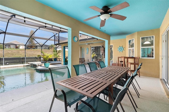 interior space with ceiling fan