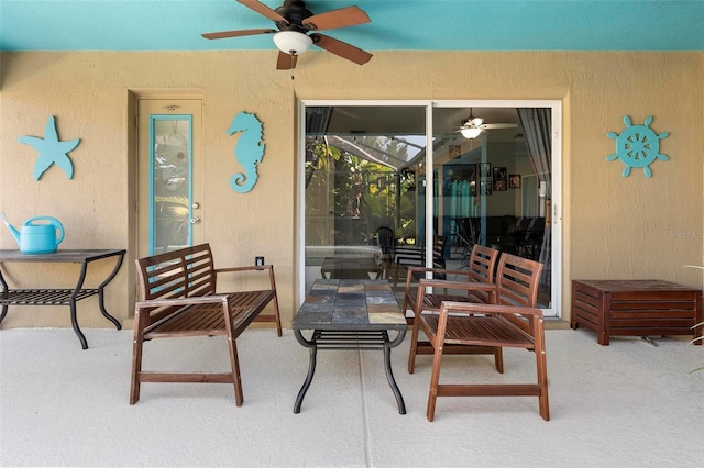 view of patio with a lanai and ceiling fan