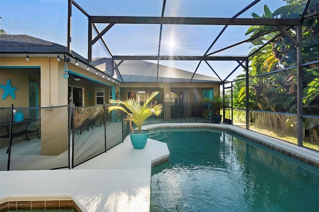 view of pool with a lanai