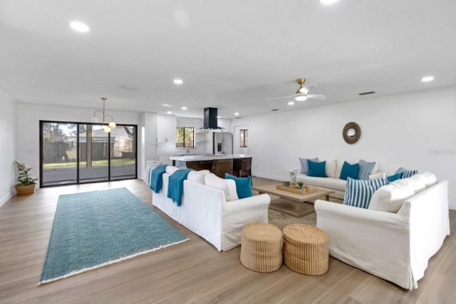 5355 Fay Blvd, Cocoa, FL 32927 - living room with recessed lighting, light wood-style floors, a ceiling fan, and baseboards