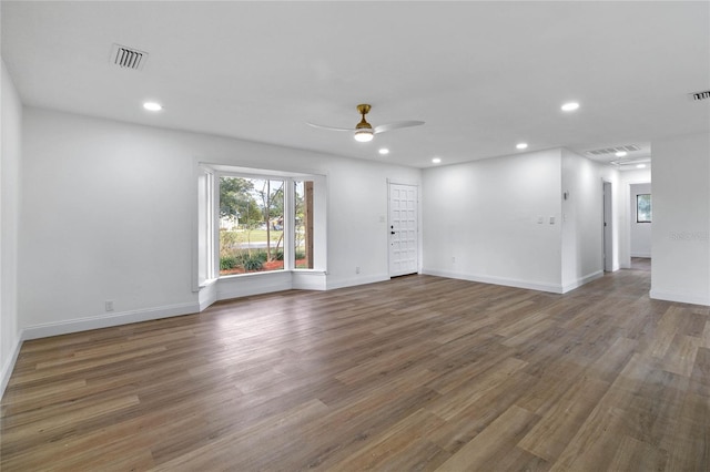 5355 Fay Blvd, Cocoa, FL 32927 - empty room with ceiling fan, wood finished floors, visible vents, and recessed lighting
