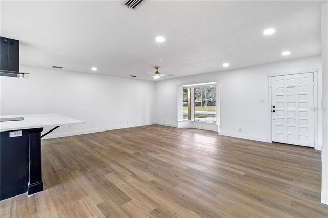 5355 Fay Blvd, Cocoa, FL 32927 - unfurnished living room with a ceiling fan, light wood-style floors, baseboards, visible vents, and recessed lighting
