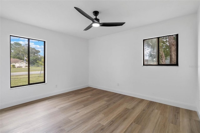 5355 Fay Blvd, Cocoa, FL 32927 - unfurnished room with light wood finished floors, baseboards, and ceiling fan