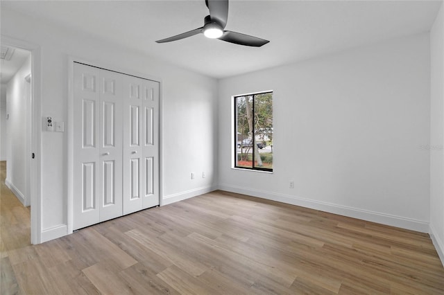 5355 Fay Blvd, Cocoa, FL 32927 - unfurnished bedroom featuring light wood finished floors, attic access, baseboards, and a closet