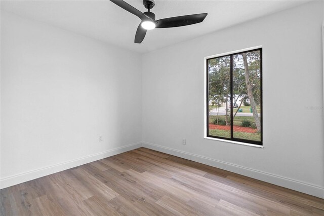 5355 Fay Blvd, Cocoa, FL 32927 - spare room featuring wood finished floors, baseboards, and ceiling fan