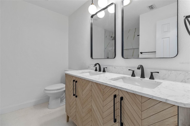 5355 Fay Blvd, Cocoa, FL 32927 - full bath featuring visible vents, a sink, double vanity, and toilet