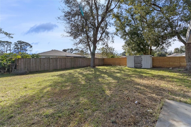 5355 Fay Blvd, Cocoa, FL 32927 - view of yard with a fenced backyard, an outdoor structure, and a shed