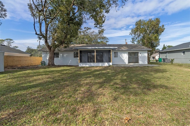 5355 Fay Blvd, Cocoa, FL 32927 - rear view of property featuring a sunroom, fence, and a yard