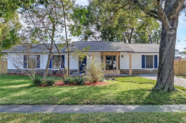 5355 Fay Blvd, Cocoa, FL 32927 - single story home featuring stucco siding, fence, stone siding, and a front yard