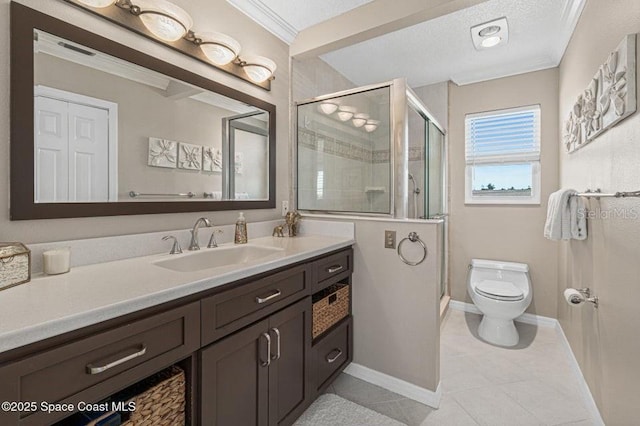 bathroom featuring tile patterned floors, toilet, vanity, and ornamental molding