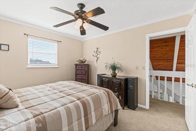 bedroom featuring ceiling fan, light colored carpet, ornamental molding, and a textured ceiling