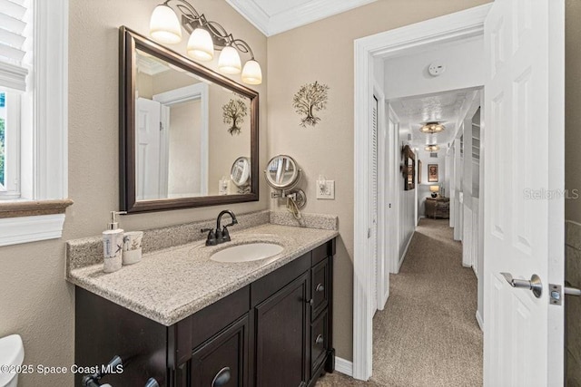 bathroom featuring vanity and crown molding