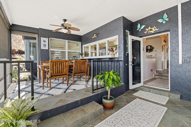 view of patio featuring ceiling fan