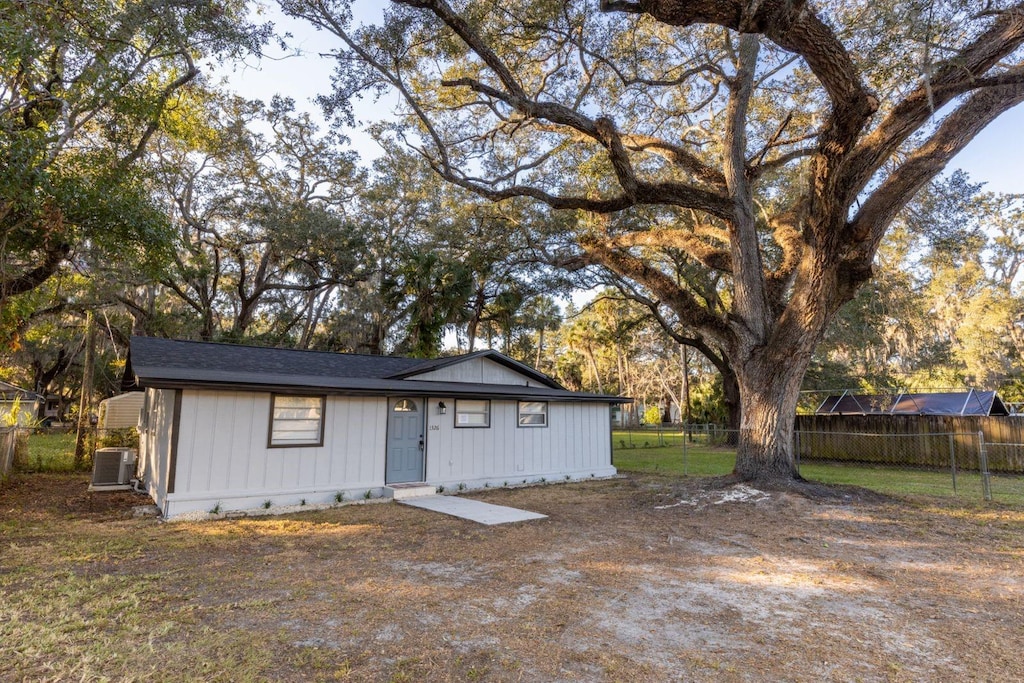 single story home with central air condition unit