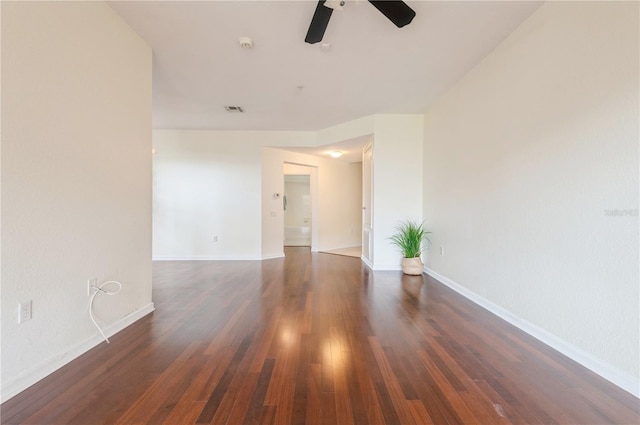 unfurnished room featuring ceiling fan and dark hardwood / wood-style flooring