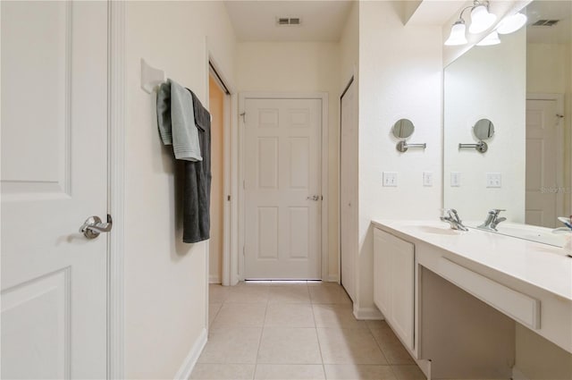 bathroom with tile patterned floors and vanity