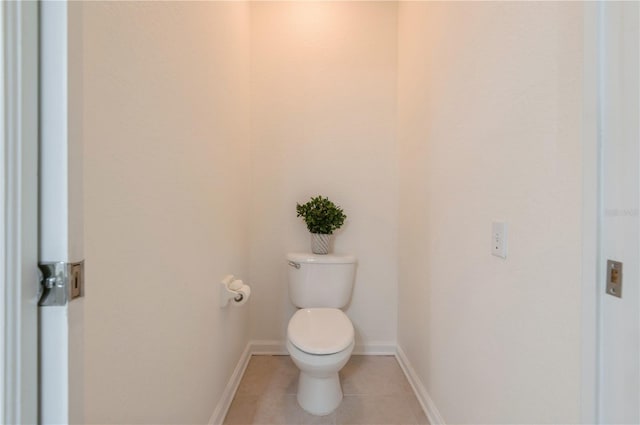 bathroom with tile patterned flooring and toilet