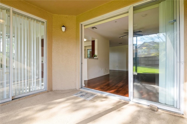 entrance to property with a patio area