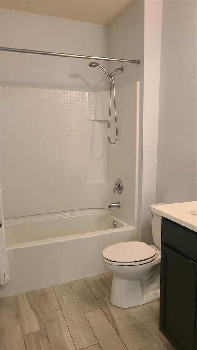 full bathroom featuring vanity, toilet, and tub / shower combination