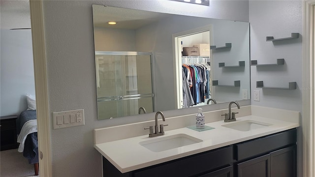 bathroom with vanity and an enclosed shower