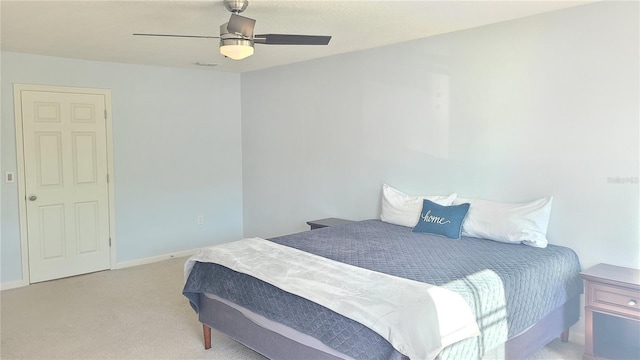 bedroom with light colored carpet and ceiling fan