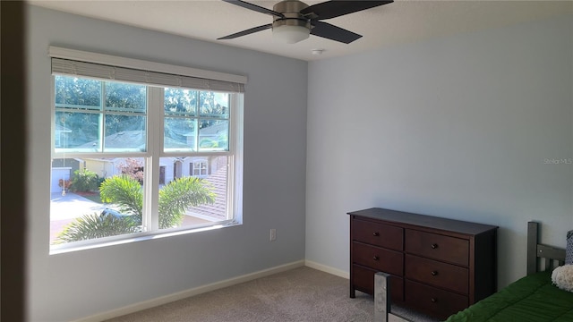 unfurnished bedroom featuring ceiling fan and light carpet