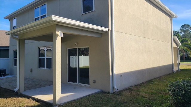 view of side of property with a patio area