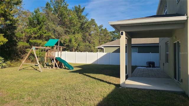 view of yard featuring a patio, a playground, and central air condition unit