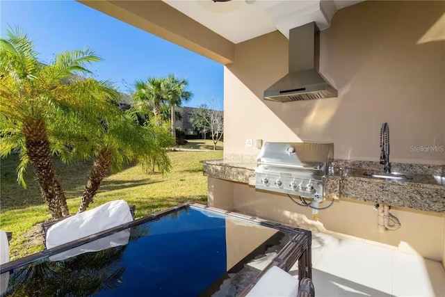 view of patio / terrace featuring a pool, area for grilling, and sink