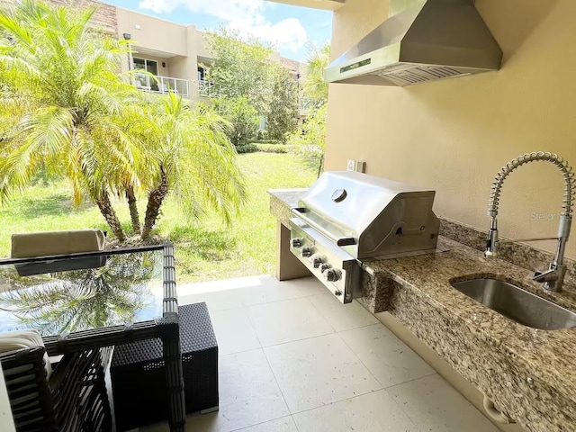 view of patio featuring area for grilling and sink