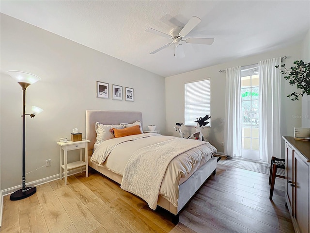 bedroom featuring ceiling fan and light hardwood / wood-style floors