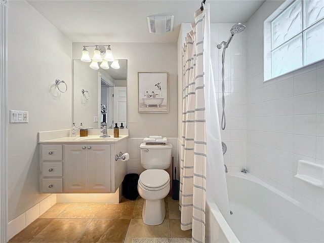 full bathroom with tile patterned flooring, vanity, toilet, and shower / tub combo