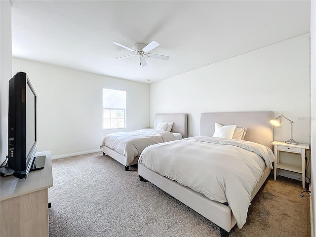 bedroom with ceiling fan and carpet floors